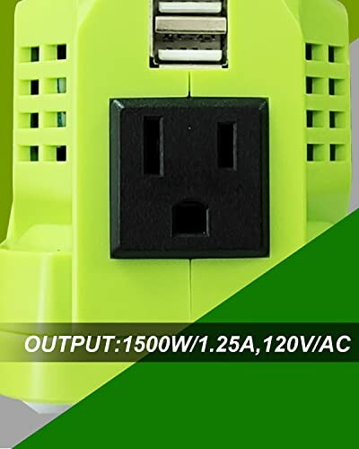 Close-up of a green power inverter with a power outlet and USB ports, indicating 1500W output.